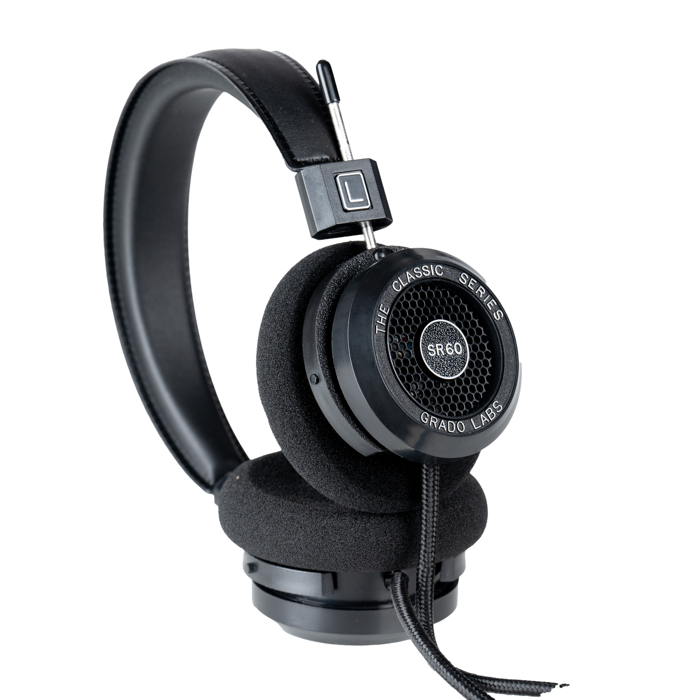 Photo of Grado SR60 Headphones taken from the 3/4 view - One ear cup is facing down while the other ear cup is facing outward - showing the model name in the center - SR60 - and the words - The Classic Series - and - Grado Labs - written along the edge of the ear cups.
