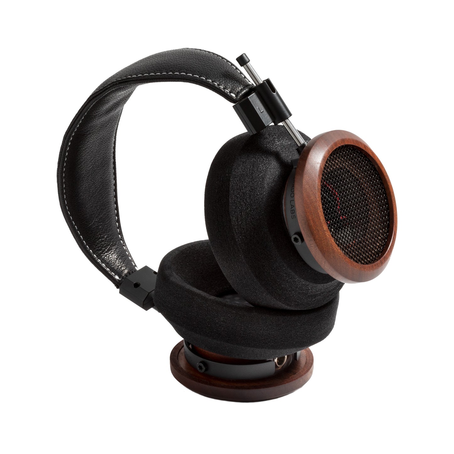 3/4 view photo of the Grado S950 Headphones taken on a white background. One ear cup is facing down while the other ear cup is facing to the side.