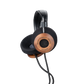 Photo of Grado GS1000 Headphones on a white background taken from the 3/4 view - One ear cup is facing down while the other ear cup is facing outward - the words - Grado Classic Series - and - GS1000 - can be seen on the ear cup.