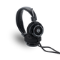 Photo of Grado SR325 Headphones taken from the 3/4 view - One ear cup is facing down while the other ear cup is facing outward - showing the model name in the center - SR325 - and the words - The Classic Series - and - Grado Labs - written along the edge of the ear cups.