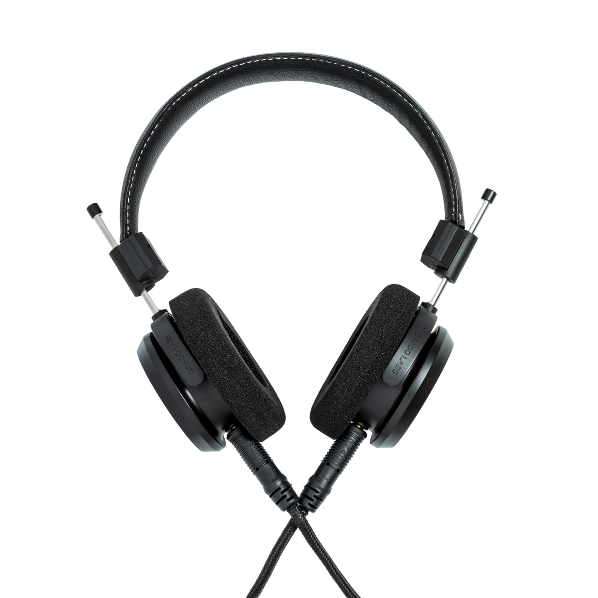 Photo of Grado S150 Headphones on a white background taken from the back - the black cables can be seen coming out of the headphone.