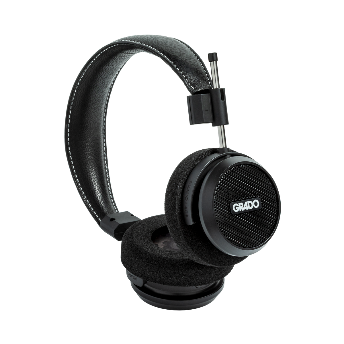 Photo of Grado S150 Headphones on a white background taken from the 3/4 view - One ear cup is facing down while the other ear cup is facing outward - showing the Grado logo.
