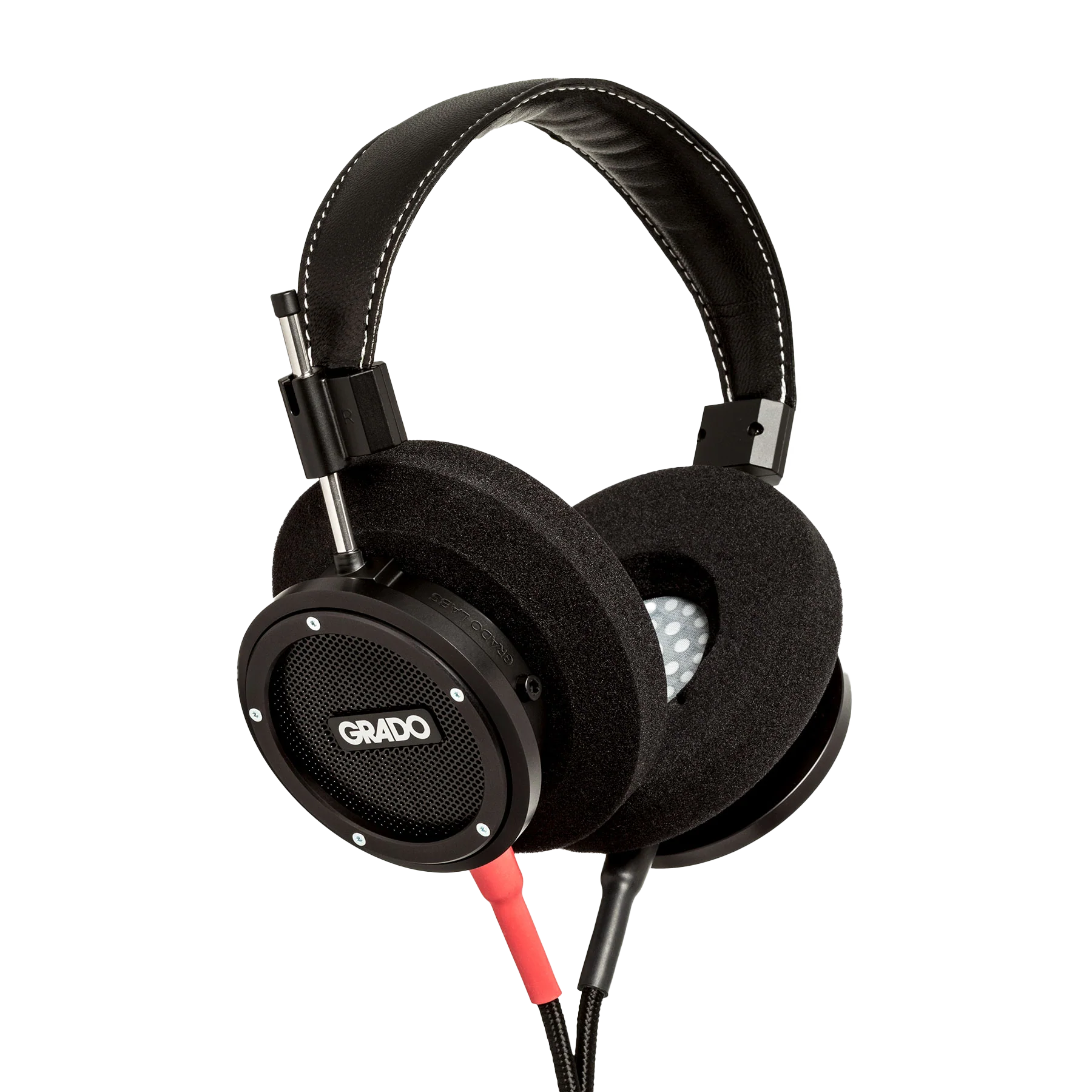 Photo of Grado S750 Headphones taken from the 3/4 view - the Grado logo is featured in the center of the ear cup and the red/black cables can be seen coming out of the headphone.
