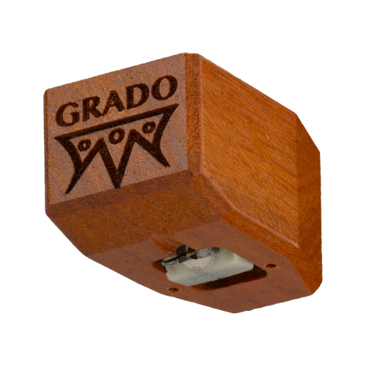 Close up photo of a Timbre Series - Master/Reference - Cartridge which is wooden and has the words GRADO and a symbol that resembles an upside down crown engraved in it.