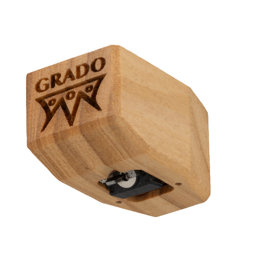 Close up photo of a Timbre Series - Sonata/Platinum - Cartridge which is wooden and has the words GRADO and a symbol that resembles an upside down crown engraved in it.